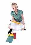 Sitting Schoolgirl Writing In Note Stock Photo