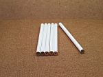 Six Unsharpened White Pencils On Wooden Board Stock Photo