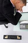 Sleeping Employee at his desk Stock Photo