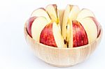 Sliced Apple In Wooden Bowl Stock Photo