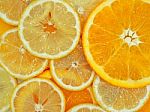 Slices Of Fresh Orange And Lemon Texture Background Stock Photo