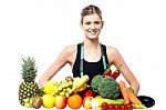 Slim Fit Girl With Fresh Fruits And Vegetables Stock Photo