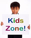 Small Boy With Kids Zone Board Stock Photo