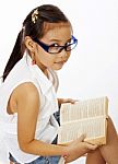 Small Girl Reading Text Book Stock Photo