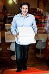 Smart Guy Holding Pizza Boxes Stock Photo