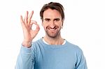 Smart Man Showing Okay Sign Stock Photo