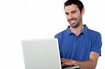 Smart Smiling Guy Working On Laptop Stock Photo