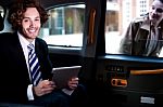 Smart Young Businessman, Inside Taxi Cab Stock Photo