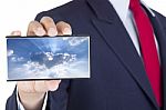 Smartphone On Businessman Hand Stock Photo