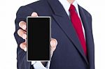 Smartphone On Businessman Hand Stock Photo