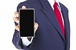 Smartphone On Businessman Hand Stock Photo