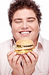 Smiled Chubby And Hamburger Stock Photo