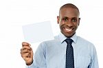 Smiling African Man Holding Blank White Card Stock Photo