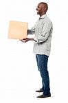 Smiling Aged Holding Carton Box Stock Photo