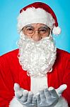 Smiling Aged Santa Posing With Open Palms Stock Photo