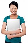 Smiling Asian Female Posing With Laptop Stock Photo