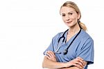 Smiling Beautiful Doctor With Crossed Arms Stock Photo