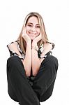 Smiling Blonde Woman Sitting Stock Photo