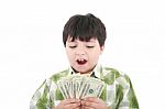 Smiling Boy Counting Money Stock Photo