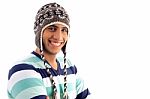 Smiling Boy Covering His Head With Woolen Cap Stock Photo