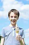 Smiling Boy Posing With An Ice Cream Stock Photo