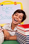 Smiling Boy With School Books Stock Photo