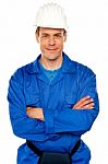 Smiling Builder With Arm Crossed Stock Photo