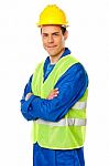 Smiling Builder With Arm Crossed Stock Photo