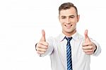 Smiling Business Executive With Thumbs Up Stock Photo