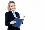 Smiling Business Girl Reading A Book Stock Photo