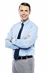 Smiling Business Representative Posing, Arms Folded Stock Photo