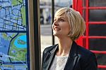 Smiling Business Woman Looking Up Stock Photo