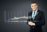 Smiling Businessman And Business Strategy Stock Photo