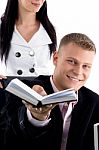 Smiling Businessman Showing Diary Stock Photo