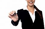 Smiling Businesswoman Holding A Key Stock Photo