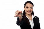 Smiling Businesswoman Holding A Key Stock Photo