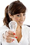 Smiling Businesswoman Holding Bulb Stock Photo