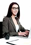 Smiling Businesswoman Using Laptop Stock Photo