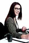 Smiling Businesswoman Writing Stock Photo