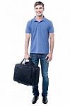 Smiling Casual Man Standing With Bag Stock Photo