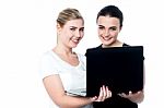 Smiling Caucasian Girls Using Laptop Stock Photo