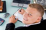 Smiling Ceo Writing on clipboard Stock Photo