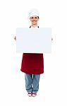 Smiling Chef Showing White Board Stock Photo