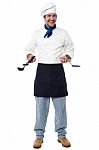 Smiling Chef With Kitchen Utensils Stock Photo