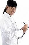 Smiling Chef Writing Stock Photo