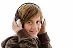 Smiling Child Enjoying Music Stock Photo