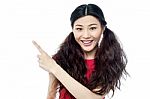 Smiling Chinese Girl Pointing Away Stock Photo