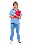 Smiling Confident Doctor Holding Clipboard Stock Photo