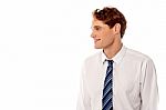 Smiling Corporate Guy Looking Away Stock Photo