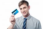 Smiling Corporate Guy Showing His Debit Card Stock Photo